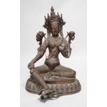 A Buddhist bronze seated figure of Green Tara. 42cm tall