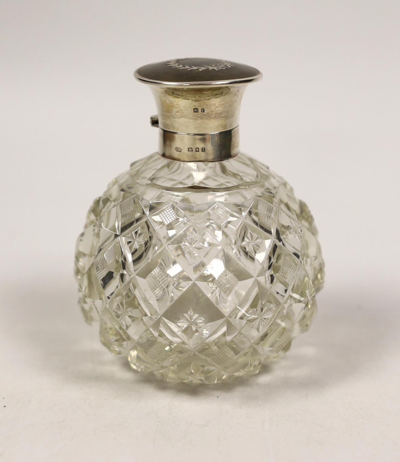 A George V silver and tortoiseshell pique mounted heavy cut glass scent bottle, London, 1921, height