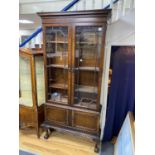 A 1920's Chippendale Revival mahogany bookcase, width 100cm, depth 30cm, height 220cm