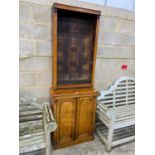 A Victorian narrow oak bookcase cupboard, width 72cm, depth 34cm, height 208cm