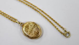 A continental engraved yellow metal oval locket, overall 38mm, on a 9ct chain, 47cm, gross weight