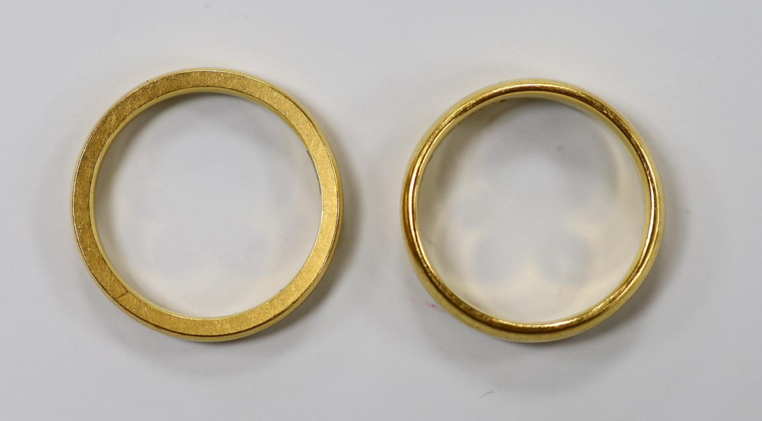 Two 22ct gold wedding bands, the larger hallmarked for Birmingham, 1924, 10.4 grams. - Image 2 of 3