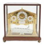 A Devon Clocks lacquered and silvered brass Congreve timepiece, in glazed mahogany case, with
