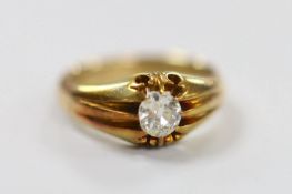 An early 20th century 18ct and claw set solitaire diamond ring, size P, gross weight 7.2 grams,