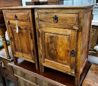 A pair of Indonesian hardwood bedside cabinets, width 43cm, depth 31cm, height 64cm