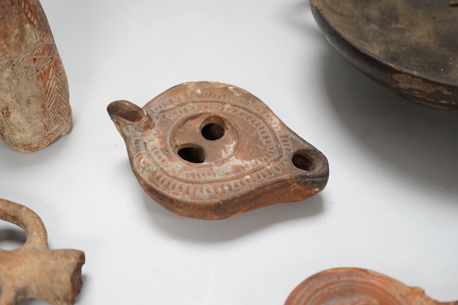 An Apulian black painted kylix, c. 4th century BCE., a Cypriot pottery flask, early Iron Age, two - Image 4 of 8