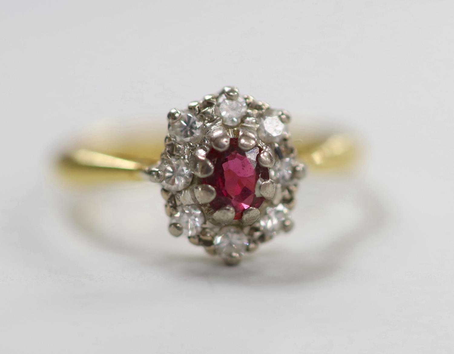 A modern 18ct gold, garnet? and diamond set oval cluster ring, size M, gross weight 3.2 grams. - Image 2 of 4