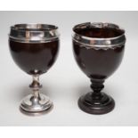 Two late 18th century white metal mounted pedestal coconut cups, one hallmarked silver for John