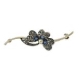 A 1920’s white gold, sapphire, cultured pearl and rose cut diamond set shamrock bar brooch, numbered