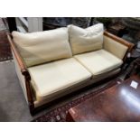 A reproduction walnut and beech two seater settee, length 174cm, depth 86cm, height 74cm