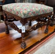 An early 20th century Jacobean revival carved beech dressing stool, length 60cm, depth 48cm,