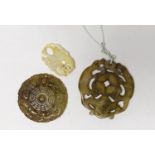 Three Chinese carved hardstone pendants