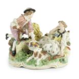 A Frankenthal porcelain bucolic group of two lovers, c.1777, modelled with a woman reclining against