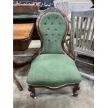 A Victorian mahogany upholstered spoon back nursing chair, height 92cm