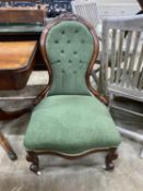 A Victorian mahogany upholstered spoon back nursing chair, height 92cm