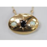 A 1970's 9ct gold and gypsy set single stone sapphire and two stone white opal set oval pendant