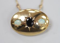A 1970's 9ct gold and gypsy set single stone sapphire and two stone white opal set oval pendant