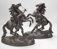 A pair of spelter Marley horses, 31cm