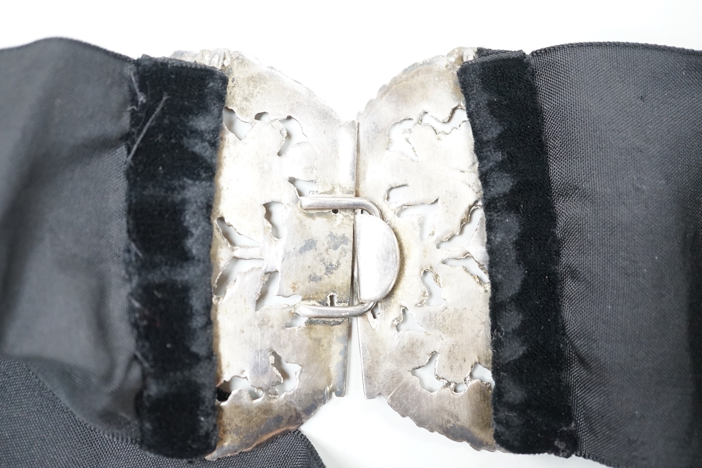 A late Victorian pierced silver belt buckle, on a black sash belt, James Deakin & Sons, Chester, - Image 3 of 3
