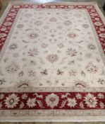 A Zeigler style ivory ground carpet, 305 x 243cm