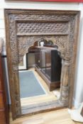 An Indian carved hardwood rectangular wall mirror, width 85cm, height 137cm