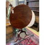 A George III and later mahogany circular tilt top tripod tea table, diameter 73cm, height 70cm