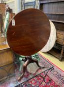 A George III and later mahogany circular tilt top tripod tea table, diameter 73cm, height 70cm
