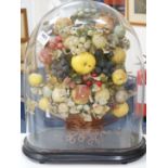 A Victorian display of papier mache fruit in a basket, under a glass dome, 55cms high