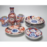 A group of Imari vases and dishes, tallest 19cm