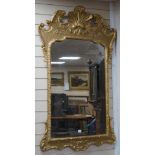 A George II style carved giltwood and composition wall mirror, width 76cm, height 135cm