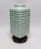 A Chinese celadon glazed eight trigrams cong vase, Guangxu mark, wood stand, 35cms high