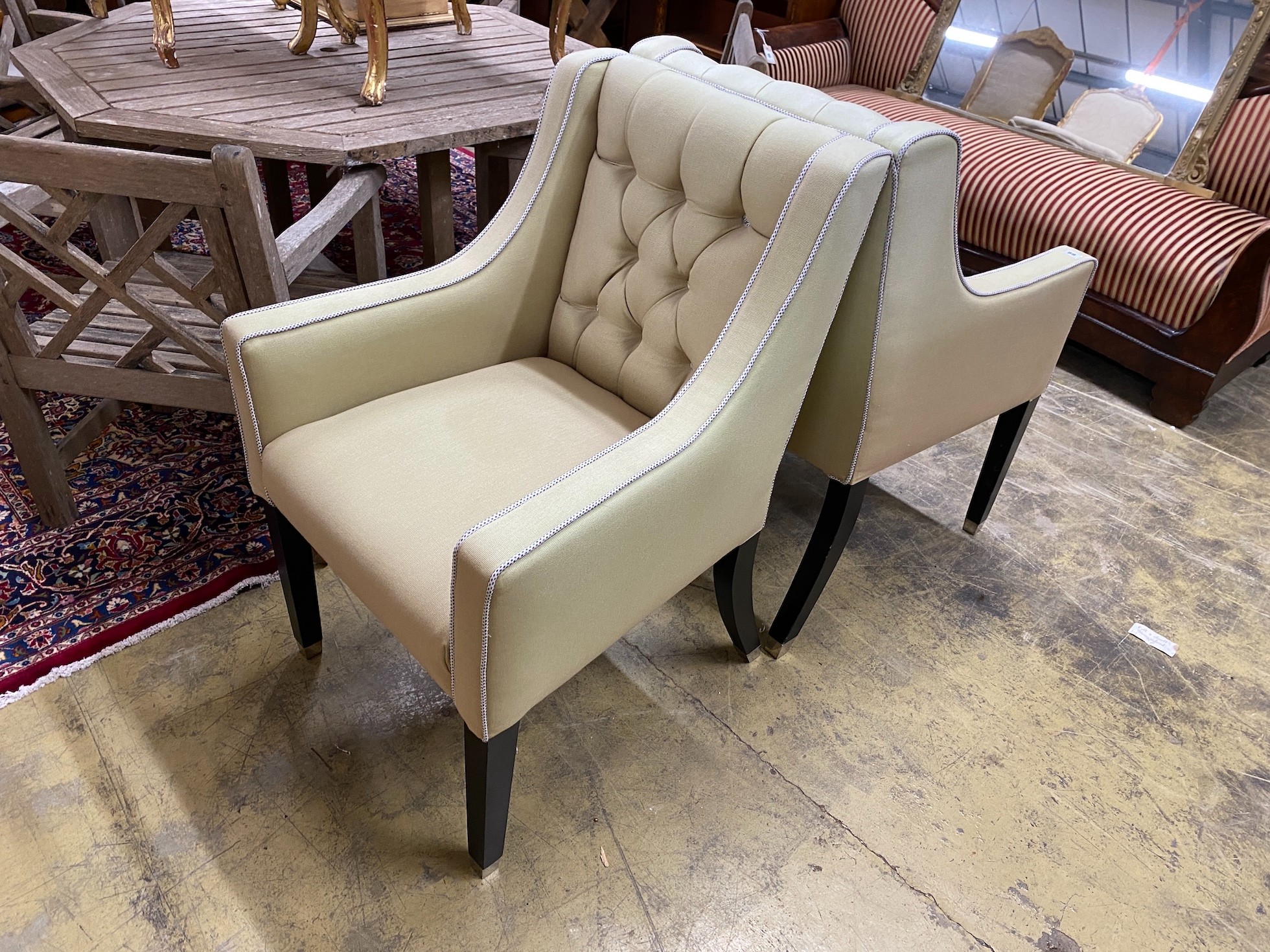 A pair of contemporary armchairs with deep buttoned backs on ebonised underframes, width 64cm, depth - Image 2 of 2