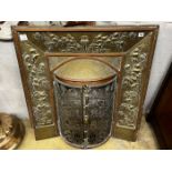 An Edwardian embossed brass and copper bowfront fire surround, width 86cm, height 89cm
