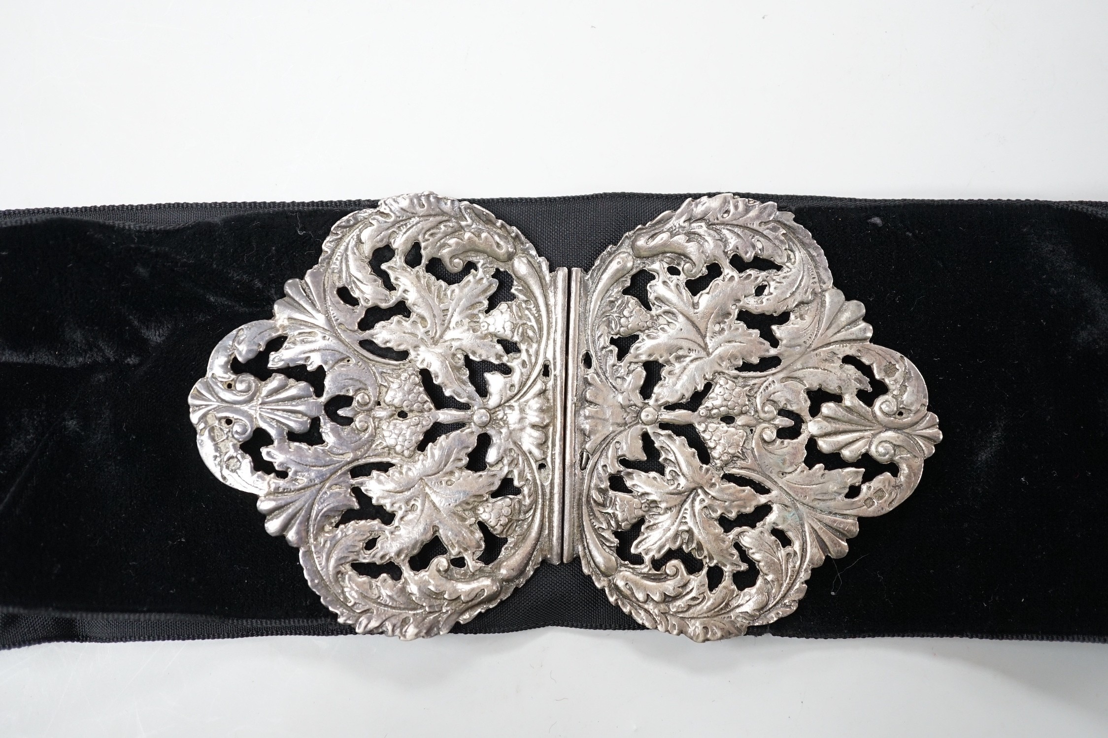 A late Victorian pierced silver belt buckle, on a black sash belt, James Deakin & Sons, Chester, - Image 2 of 3