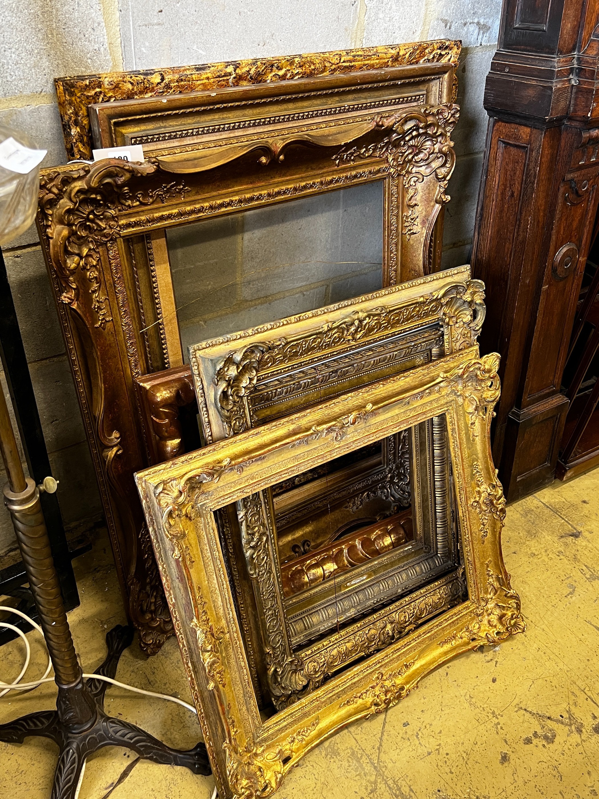 Eight Victorian and later giltwood and composition rectangular picture frames, largest 76 x 94cm