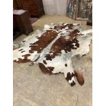 A cow hide rug, width 205cm