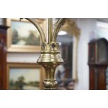 A pair of Victorian Gothic brass ecclesiastical three branch floor lamps, converted to