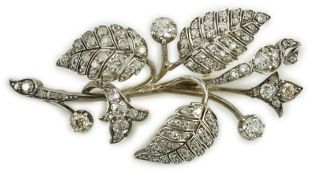 A mid 20th century yellow and white metal, diamond cluster set floral spray brooch, 61mm, gross