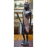 A tall West African carved figure of a warrior, 100cm