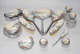 A twelve piece chrome plated and enamel dressing table set