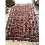 A Belouch blue ground geometric rug 240cm x 140cm