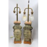 A pair of Chinese archaistic bronze vases, converted into table lamps, 62cms high including light