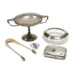 A George V silver tazza, a silver cigarette case, a pair of George III silver sugar tongs, a