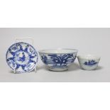 A Chinese Kangxi blue and white tea bowl and saucer, and a blue and white bowl, largest 13cm