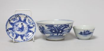 A Chinese Kangxi blue and white tea bowl and saucer, and a blue and white bowl, largest 13cm