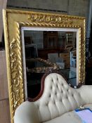 A large Victorian style rectangular carved giltwood frame, width 142cm, height 180cm