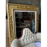 A large Victorian style rectangular carved giltwood frame, width 142cm, height 180cm