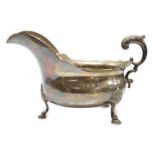 A late Victorian silver sauce boat, with flying scroll handle, Charles Boyton, London, 1897,