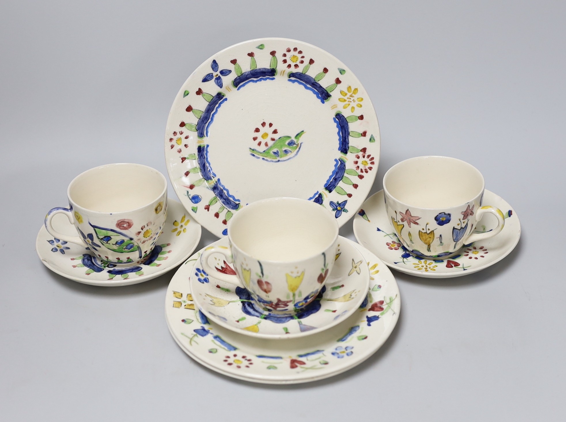 Jessie Marion King (1875-1949). Three different floral design tea cups, saucers and plates