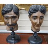 Two 20th century Italian carved and painted wooden heads on stands, 47cm
